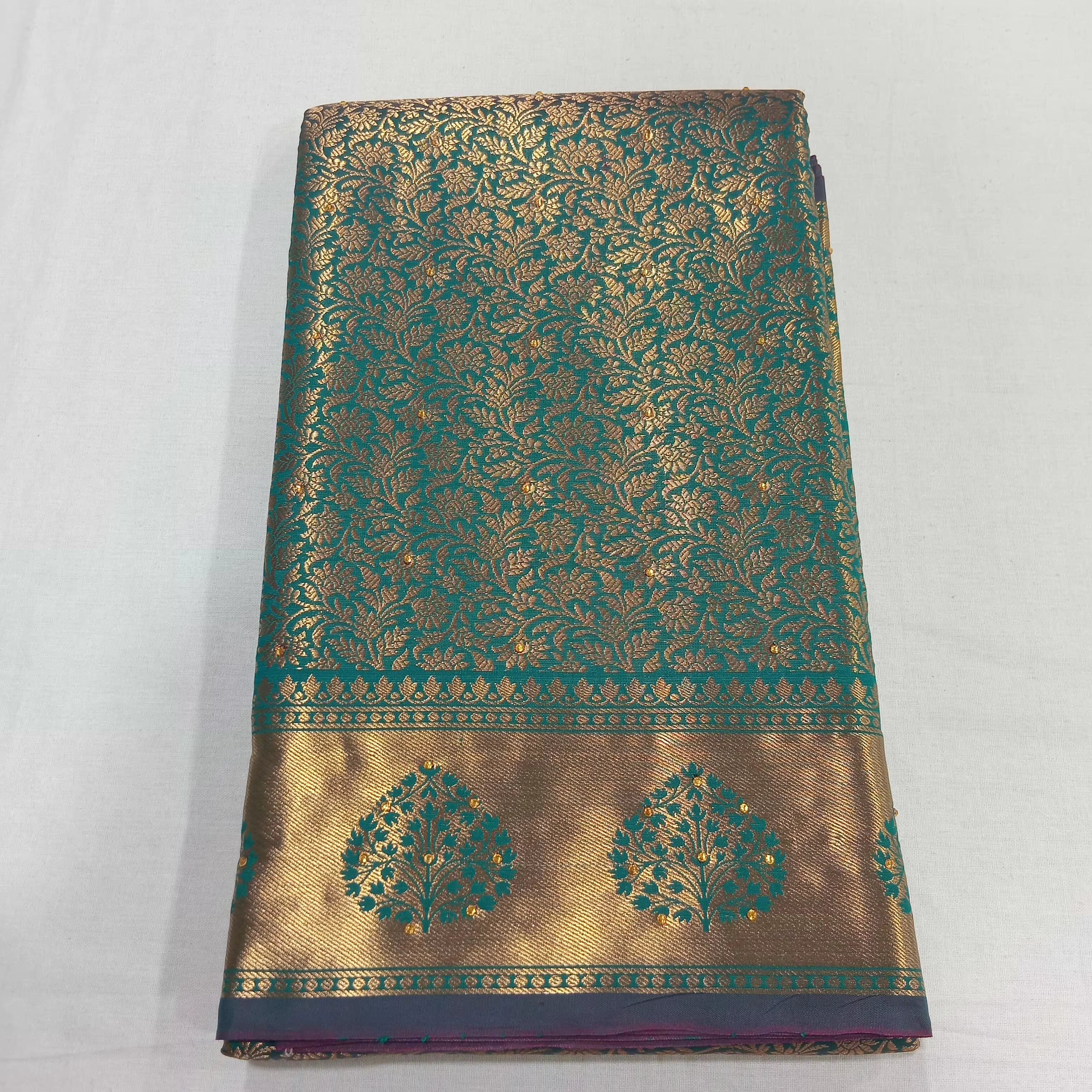 Kanchipuram Pure Silk Saree with detailed Gold Zari Butta motifs and luxurious Pallu with stick on Minakari in Bluish Green color