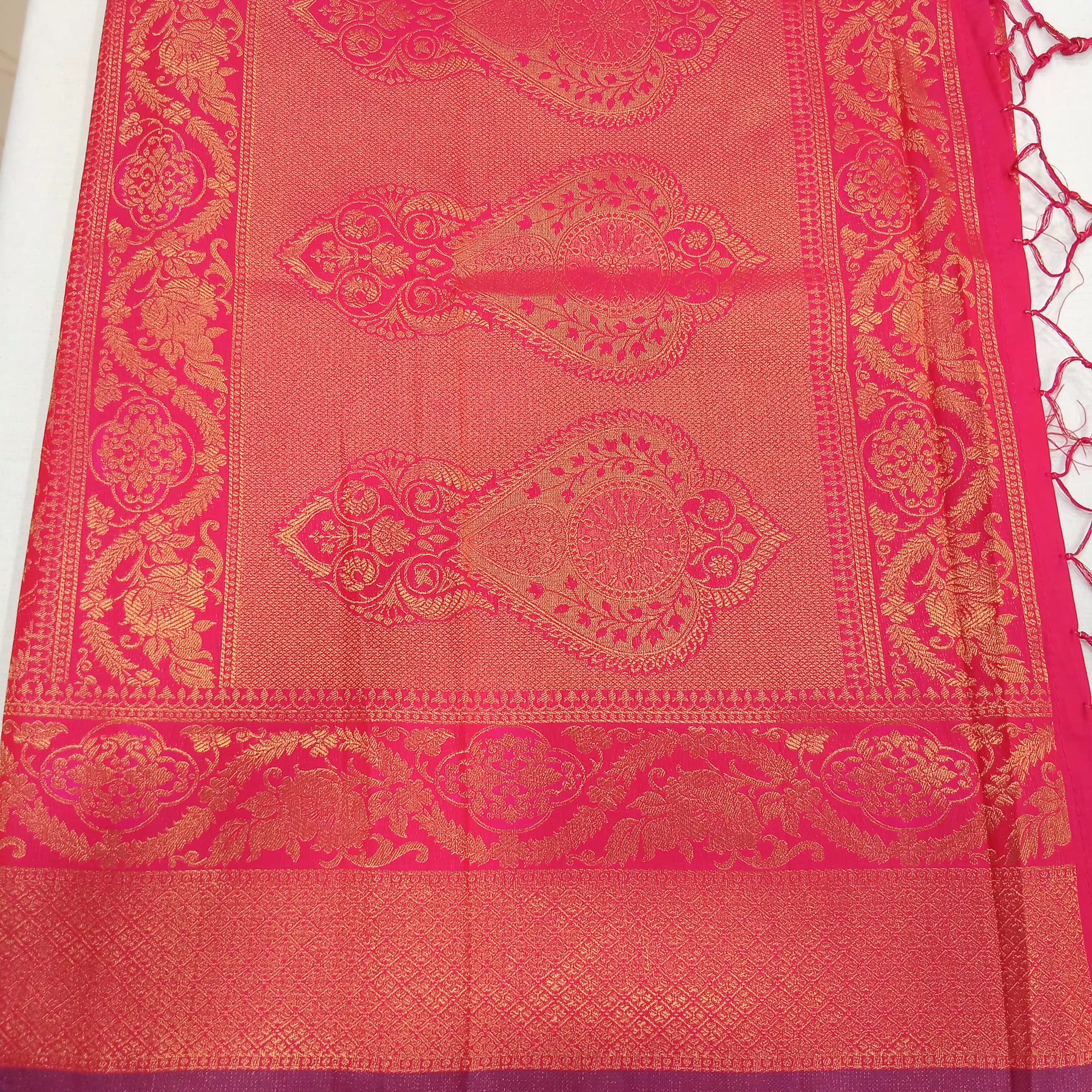 Kanchipuram Pure Silk Saree with detailed Butta motifs and luxurious Pallu in Royal Pink color
