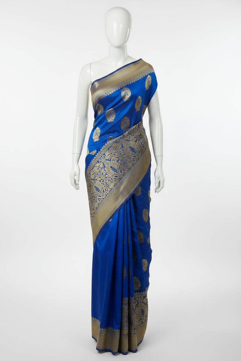 Banarasi Pure Silk Saree with beautiful buttas with pretty gold zari work all over the saree in Royal Blue color with wide gold zari border