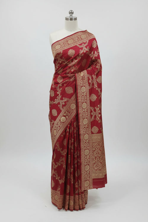 Banarasi Pure Silk Saree with beautiful buttas with pretty gold zari work all over the saree in Dark Red Color
