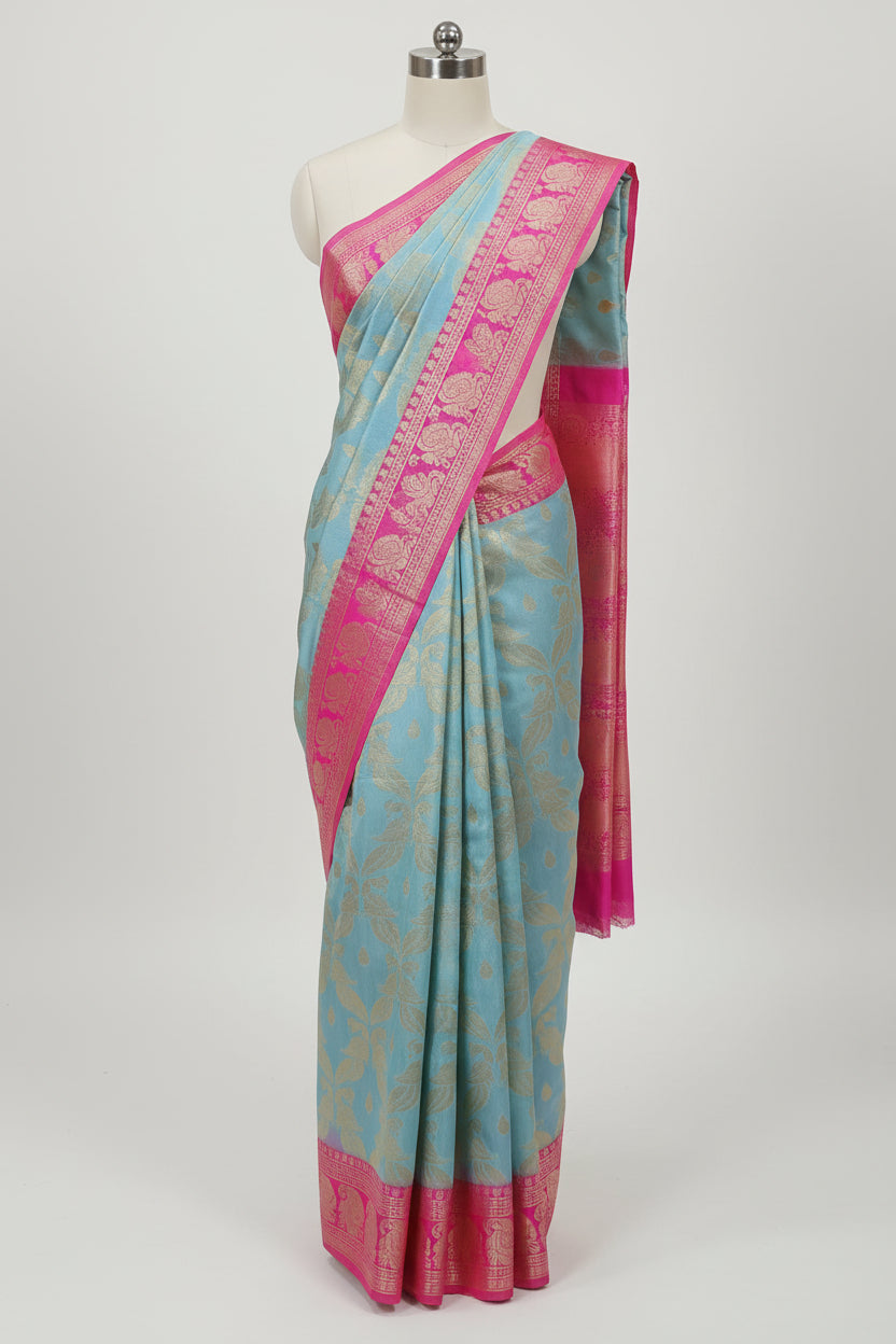 Banarasi Pure Silk Saree with beautiful buttas with pretty gold zari work all over the saree in Sky Blue Color with Pink Contrast