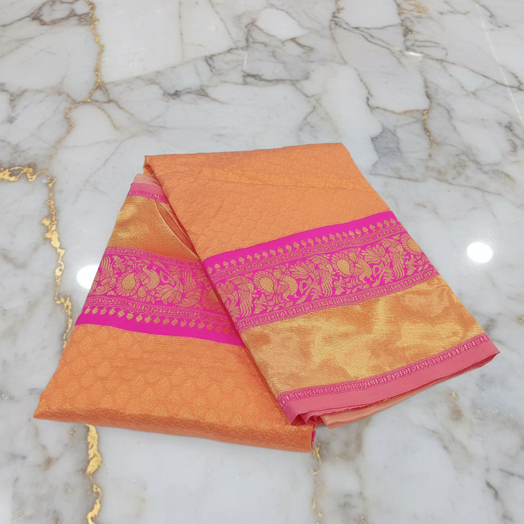Banarasi Pure Silk Saree with beautiful buttas with pretty gold zari work all over the saree in Light Orange Color with Pink Contrast