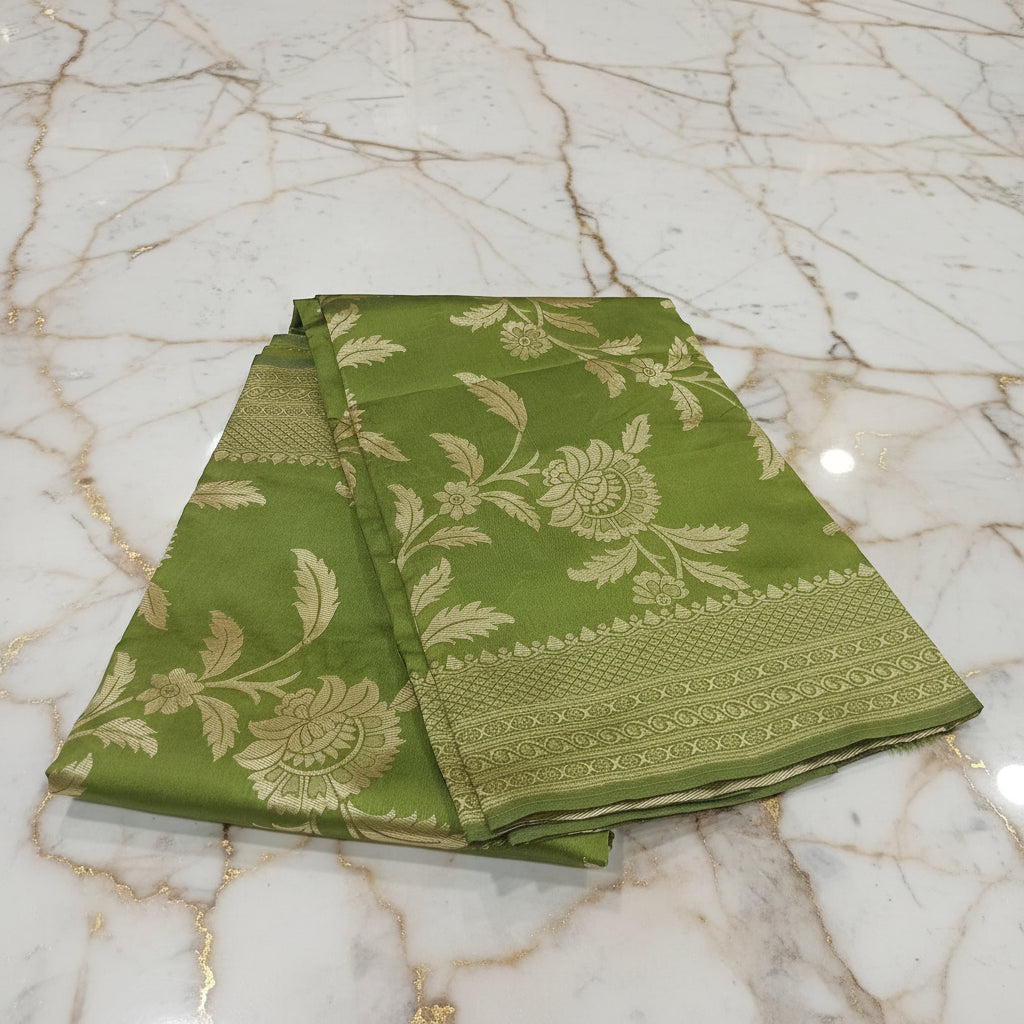 Banarasi Pure Silk Saree with beautiful buttas with pretty gold zari work all over the saree in Light Green Floral Pattern