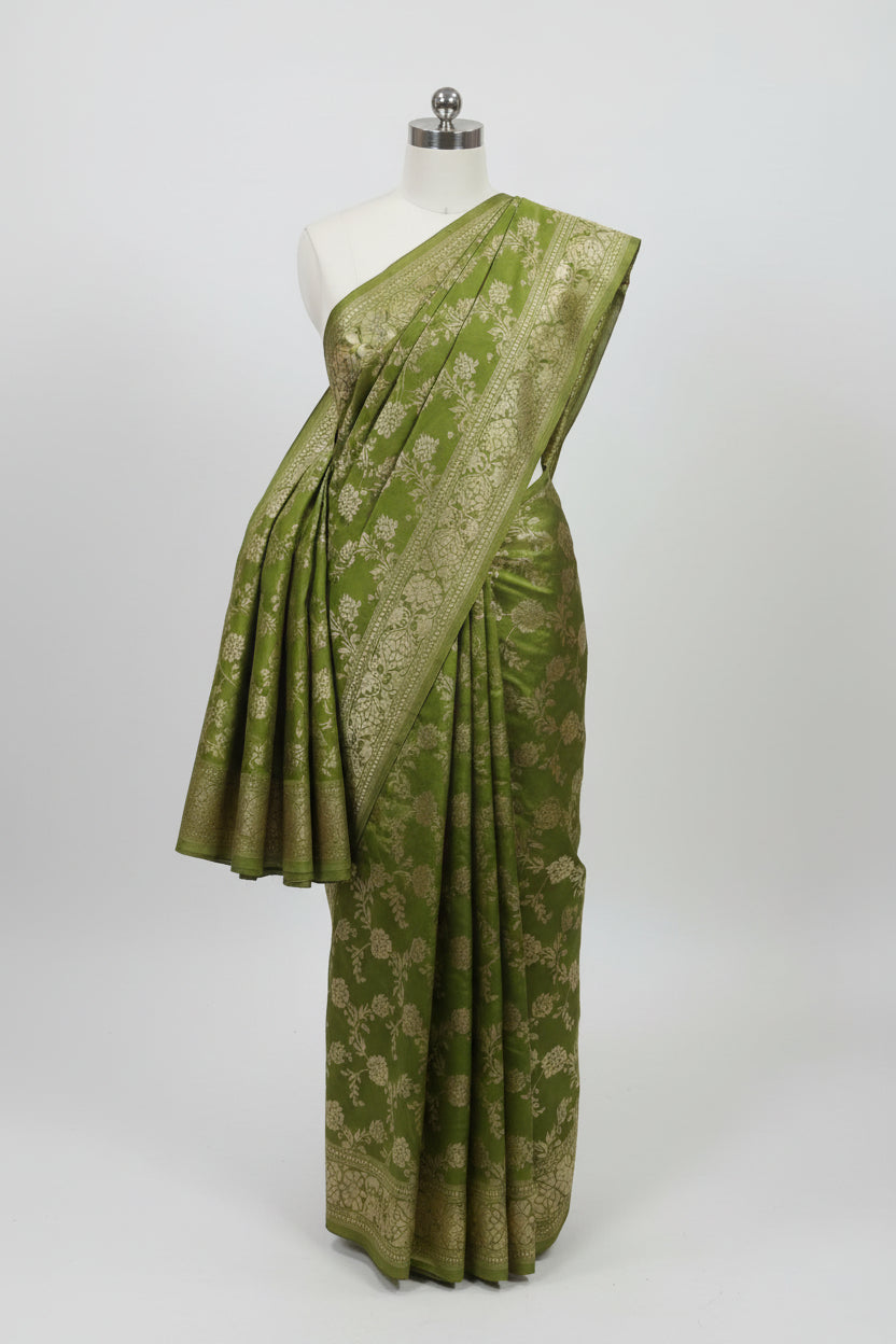 Banarasi Pure Silk Saree with beautiful buttas with pretty gold zari work all over the saree in Light Green Color