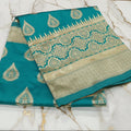 Banarasi Pure Silk Saree with beautiful buttas with pretty gold zari work all over the saree in Turquoise Green Color