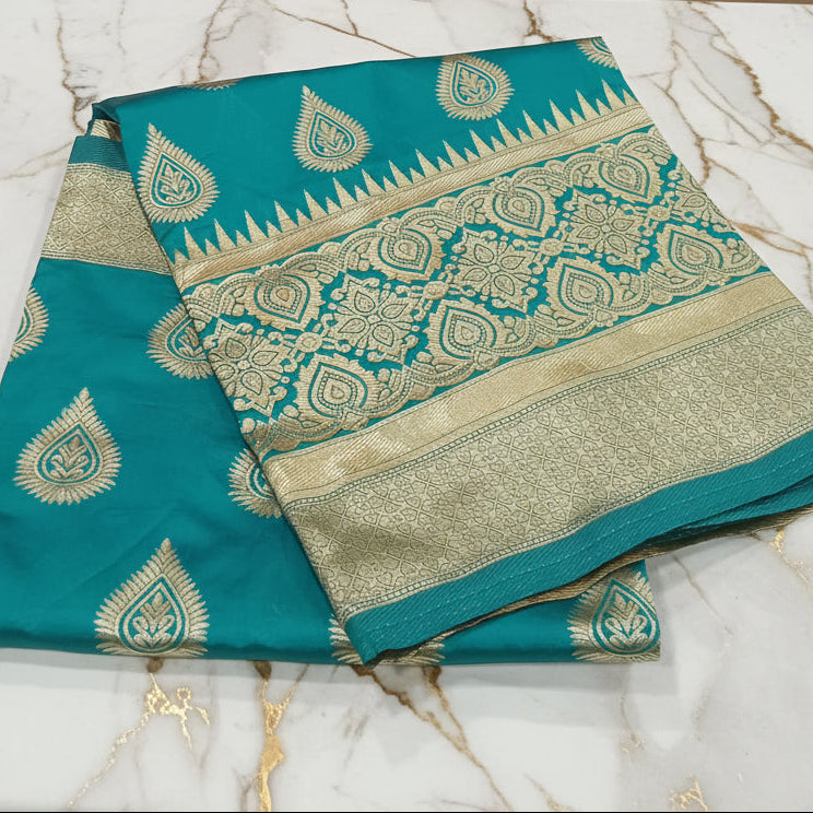 Banarasi Pure Silk Saree with beautiful buttas with pretty gold zari work all over the saree in Turquoise Green Color