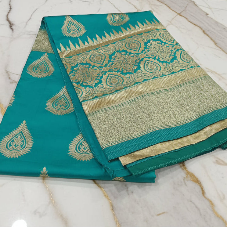 Banarasi Pure Silk Saree with beautiful buttas with pretty gold zari work all over the saree in Turquoise Green Color