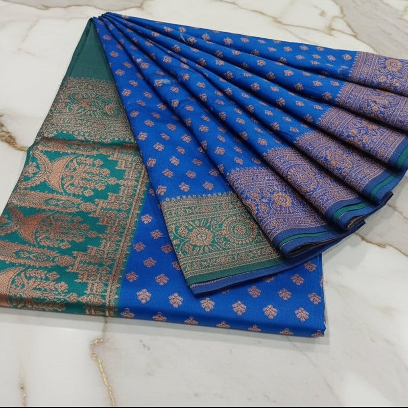 Banarasi Pure Silk Saree with luxurious Gold Zari Floral Buttas all over the saree and Pallu in Royal Blue Color Contrast Turquoise Green and Rose gold Zari