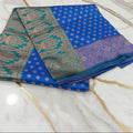 Banarasi Pure Silk Saree with luxurious Gold Zari Floral Buttas all over the saree and Pallu in Royal Blue Color Contrast Turquoise Green and Rose gold Zari
