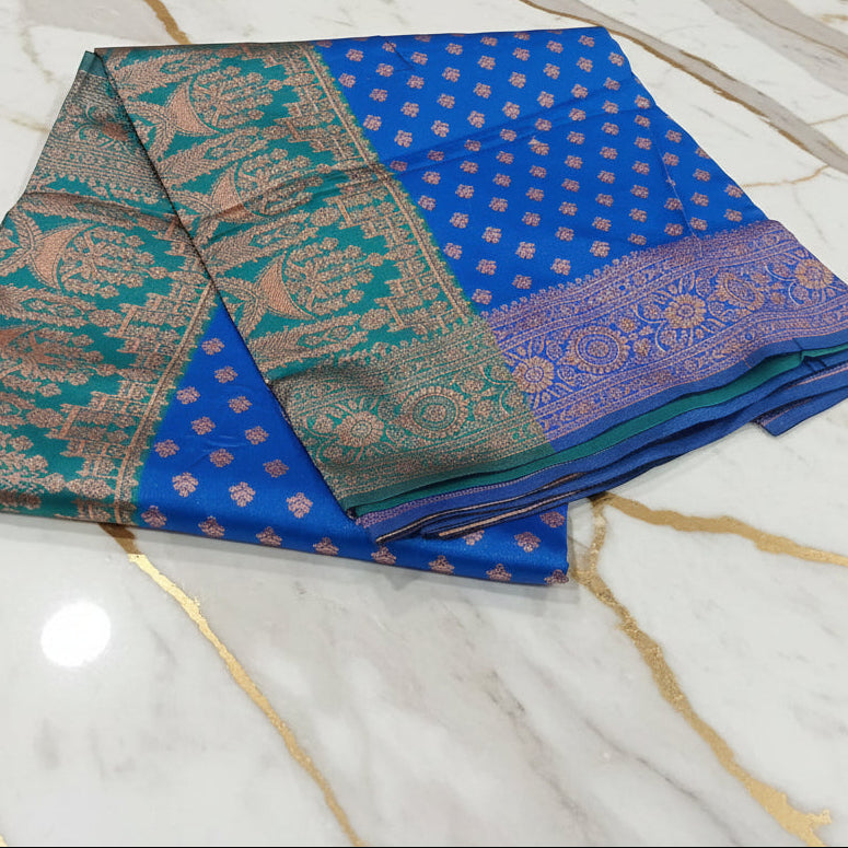 Banarasi Pure Silk Saree with luxurious Gold Zari Floral Buttas all over the saree and Pallu in Royal Blue Color Contrast Turquoise Green and Rose gold Zari