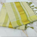 Light Green Kerala kasavu tissue silk saree with gold zari border