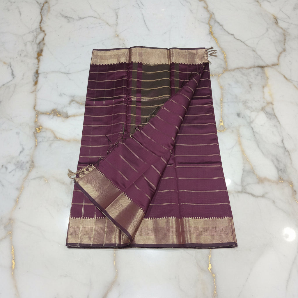 Kanchipuram Silk saree with Gold Zari big checkered pattern with Gold Butta all over saree and pallu in Maroon Color