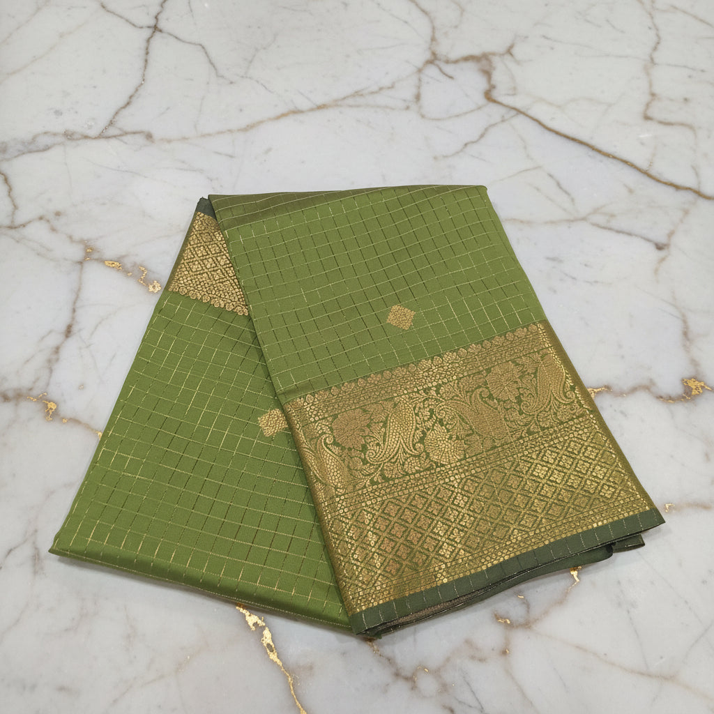 Kanchipuram Silk saree with Gold Zari checkered pattern with Gold Butta all over saree and pallu in Green color