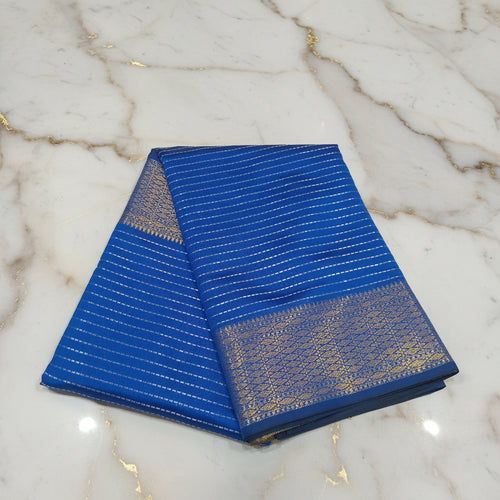 Blue Kanchipuram silk saree with zari stripes and gold zari buttas