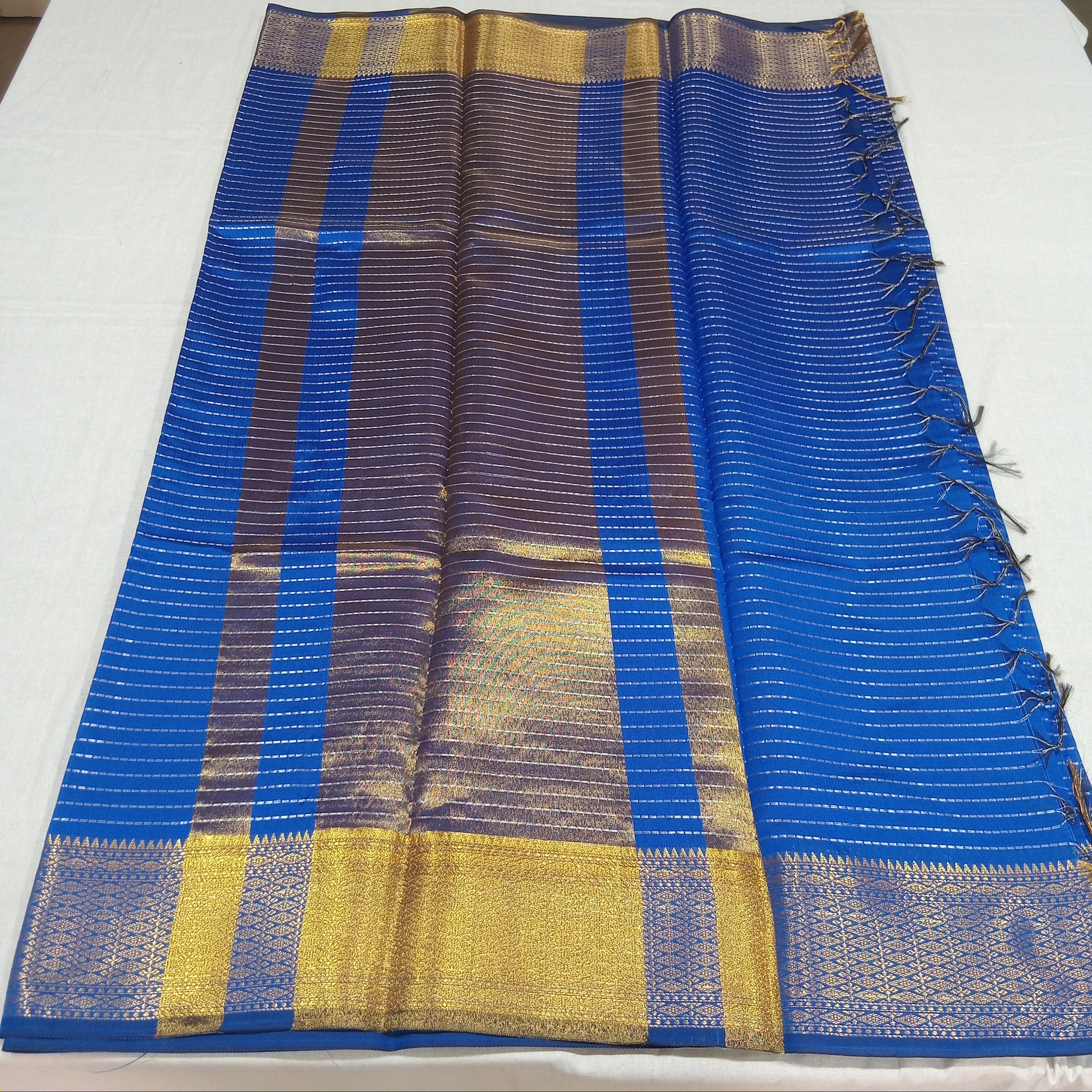 Kanchipuram Silk saree with Gold Zari Lined pattern with Gold Butta all over saree and pallu in Blue Color