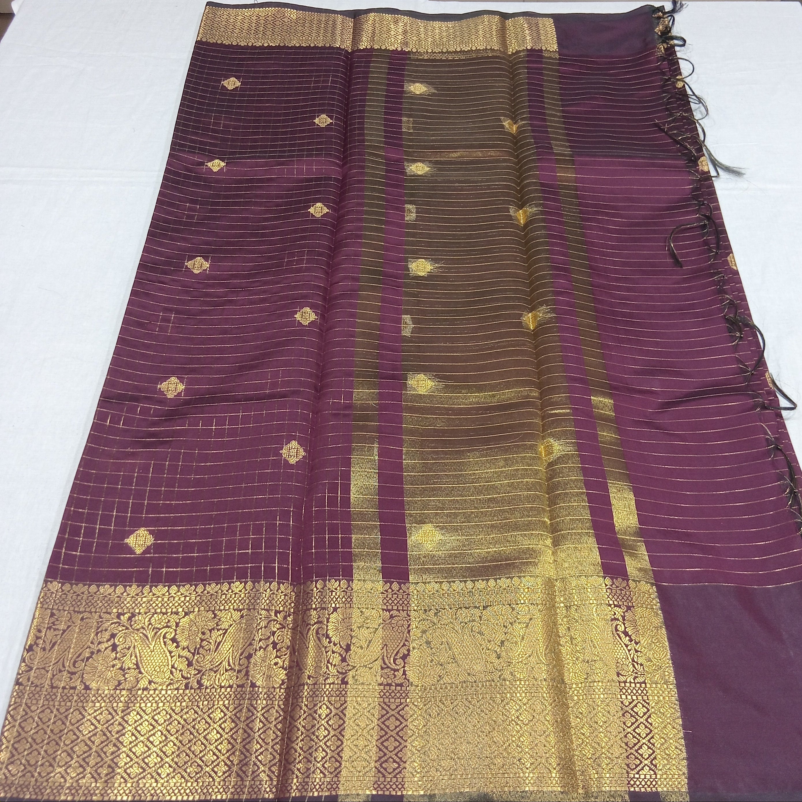 Kanchipuram Silk saree with Gold Zari checkered pattern with Gold Butta all over saree and pallu in Maroon color