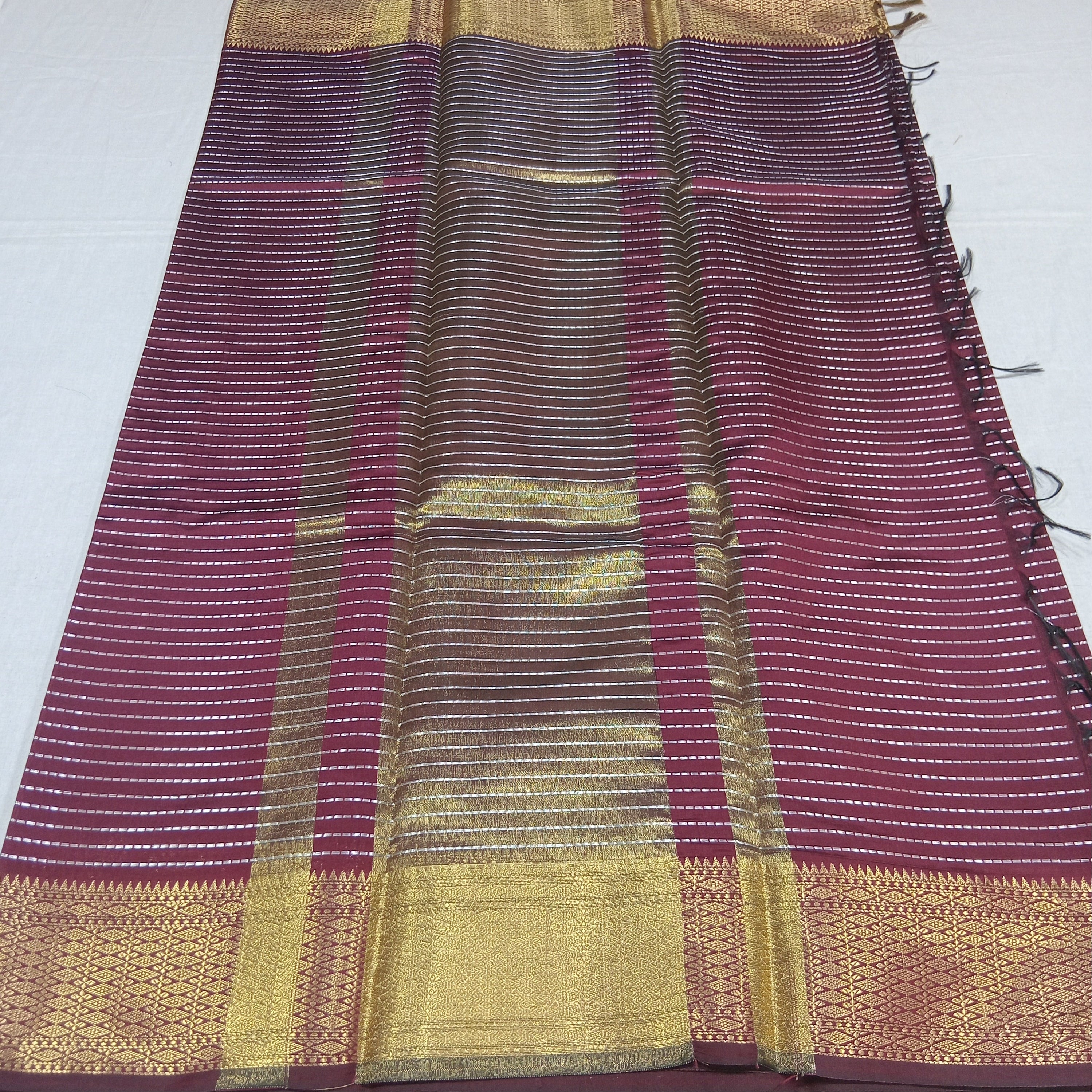 Kanchipuram Silk saree with Gold Zari Lined pattern with Gold Butta all over saree and pallu in