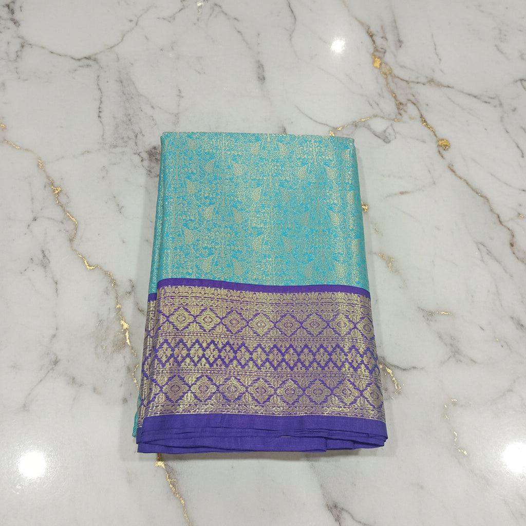 Kanchipuram Silk saree with Gold Zari pattern with Gold Butta all over saree and pallu in Bluish Blue Color