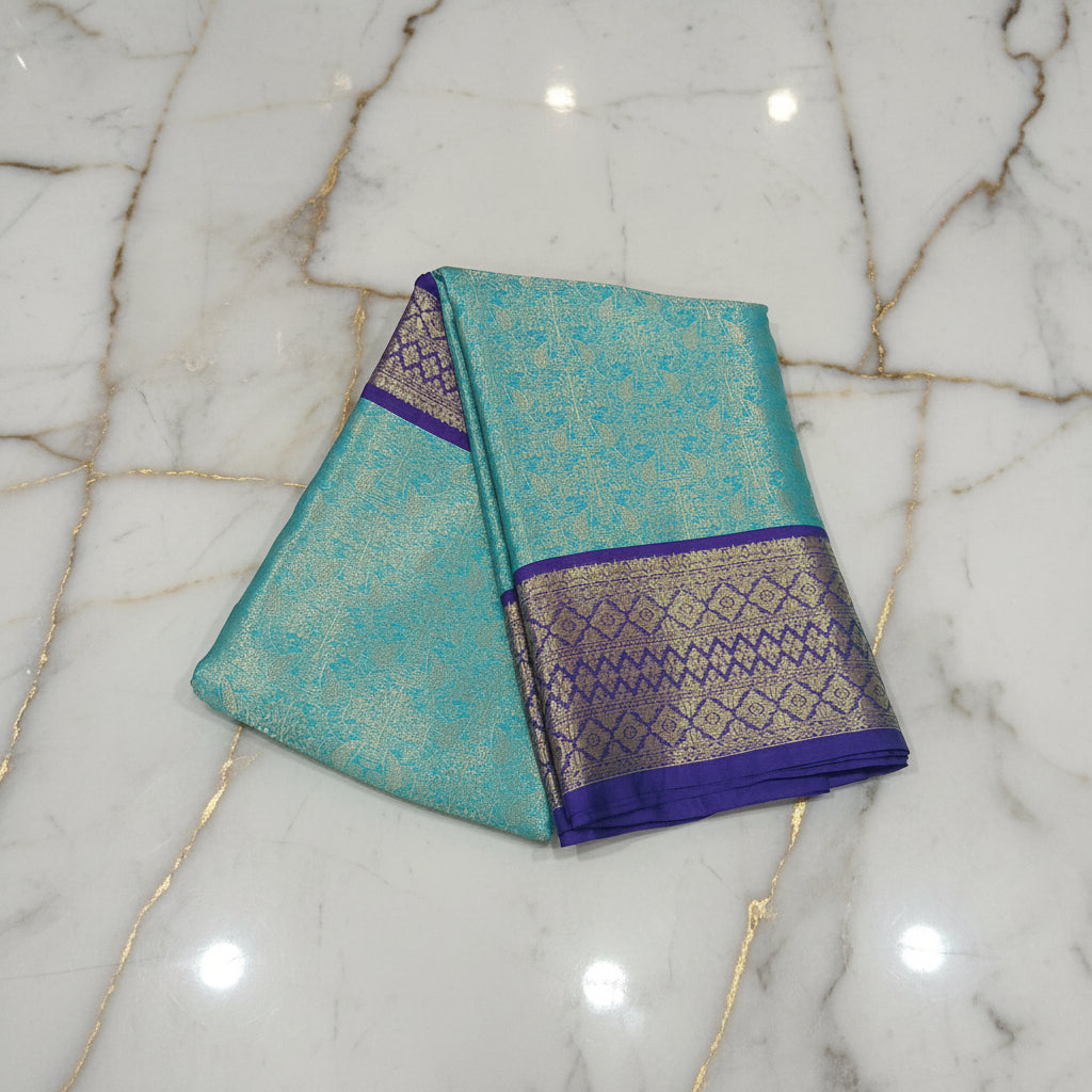 Kanchipuram Silk saree with Gold Zari pattern with Gold Butta all over saree and pallu in Bluish Blue Color