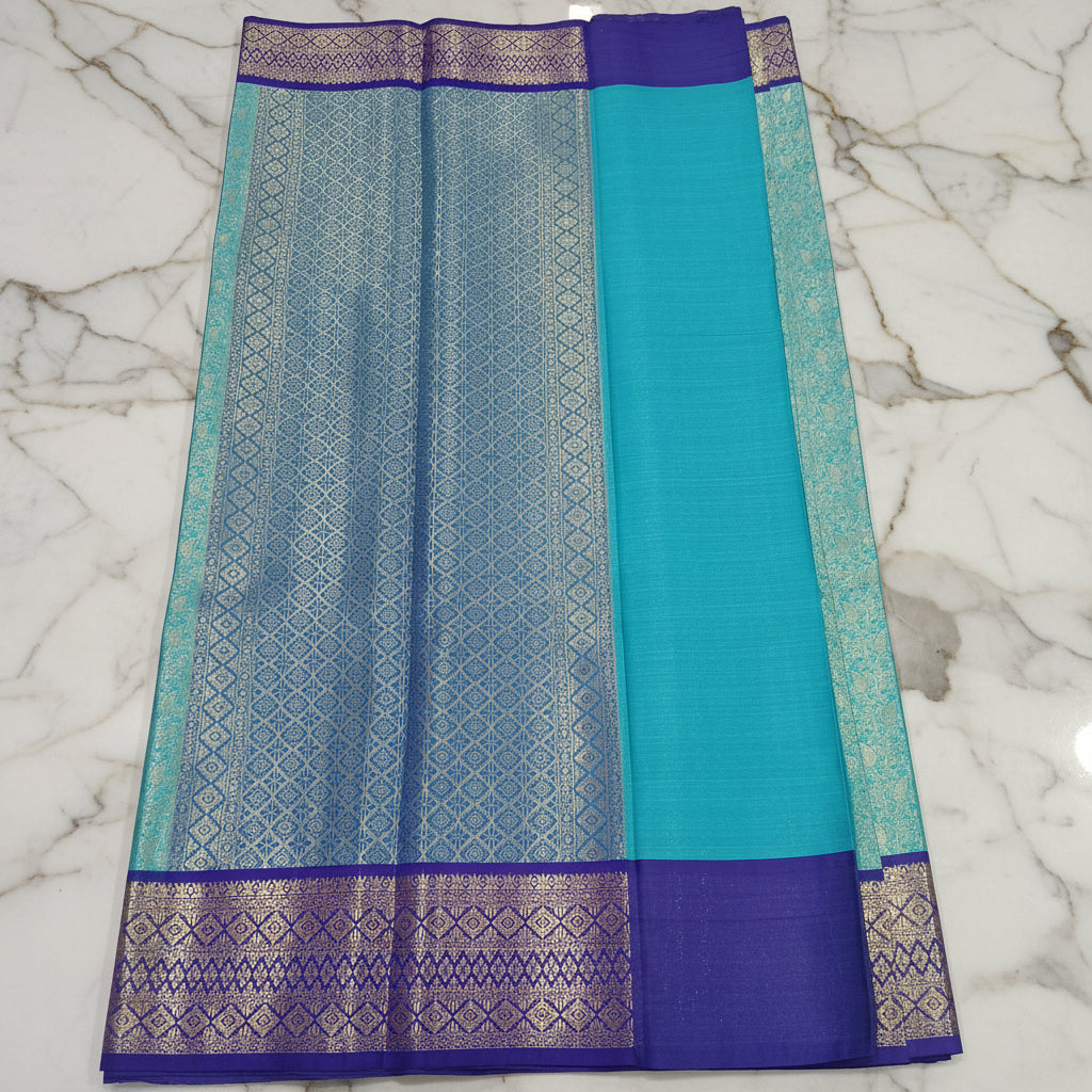 Kanchipuram Silk saree with Gold Zari pattern with Gold Butta all over saree and pallu in Bluish Blue Color