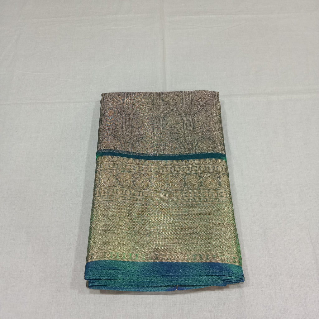 Kanchipuram Silk saree with Gold Zari pattern with Gold Butta all over saree and pallu in Greenish Green Color