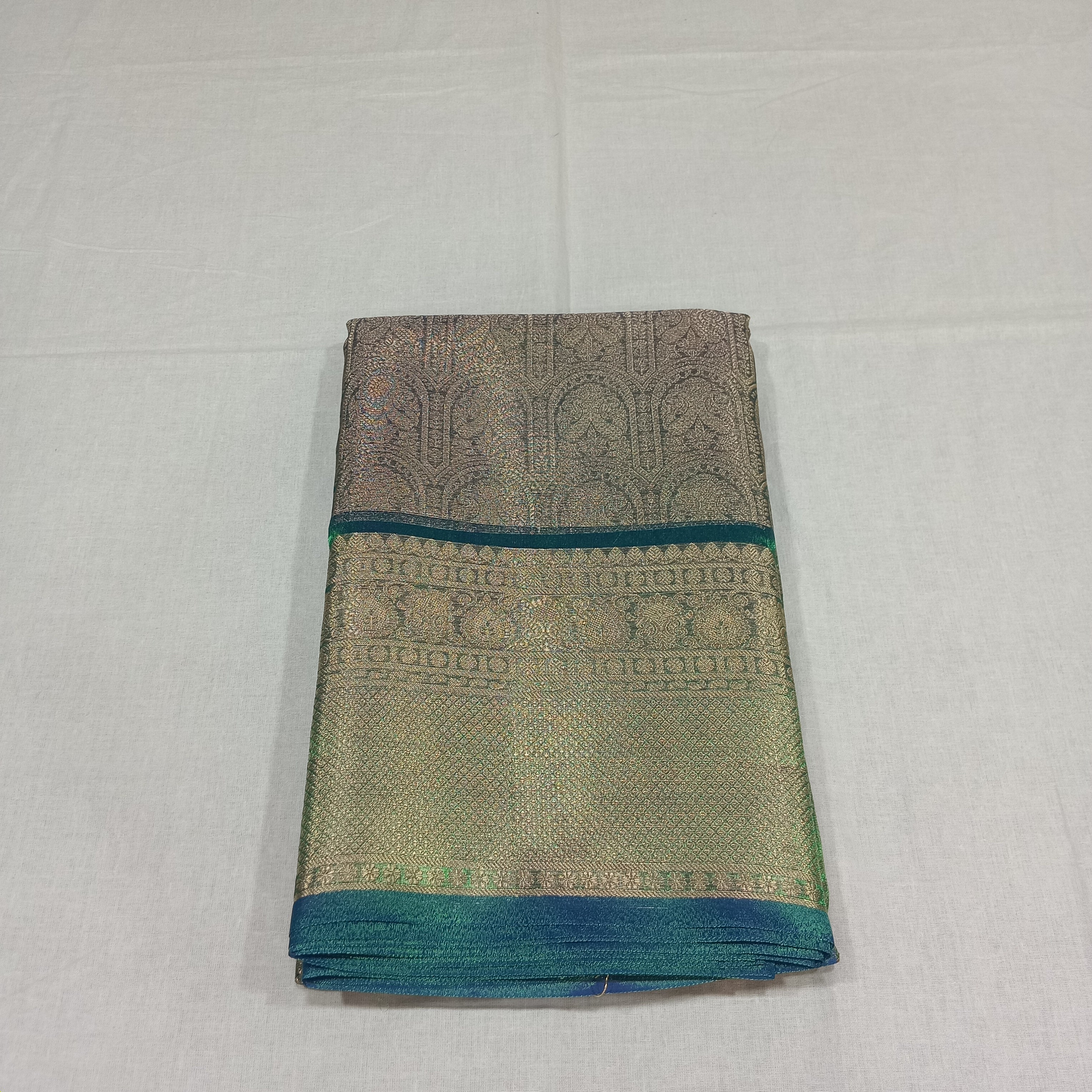 Kanchipuram Silk saree with Gold Zari pattern with Gold Butta all over saree and pallu in Greenish Green Color