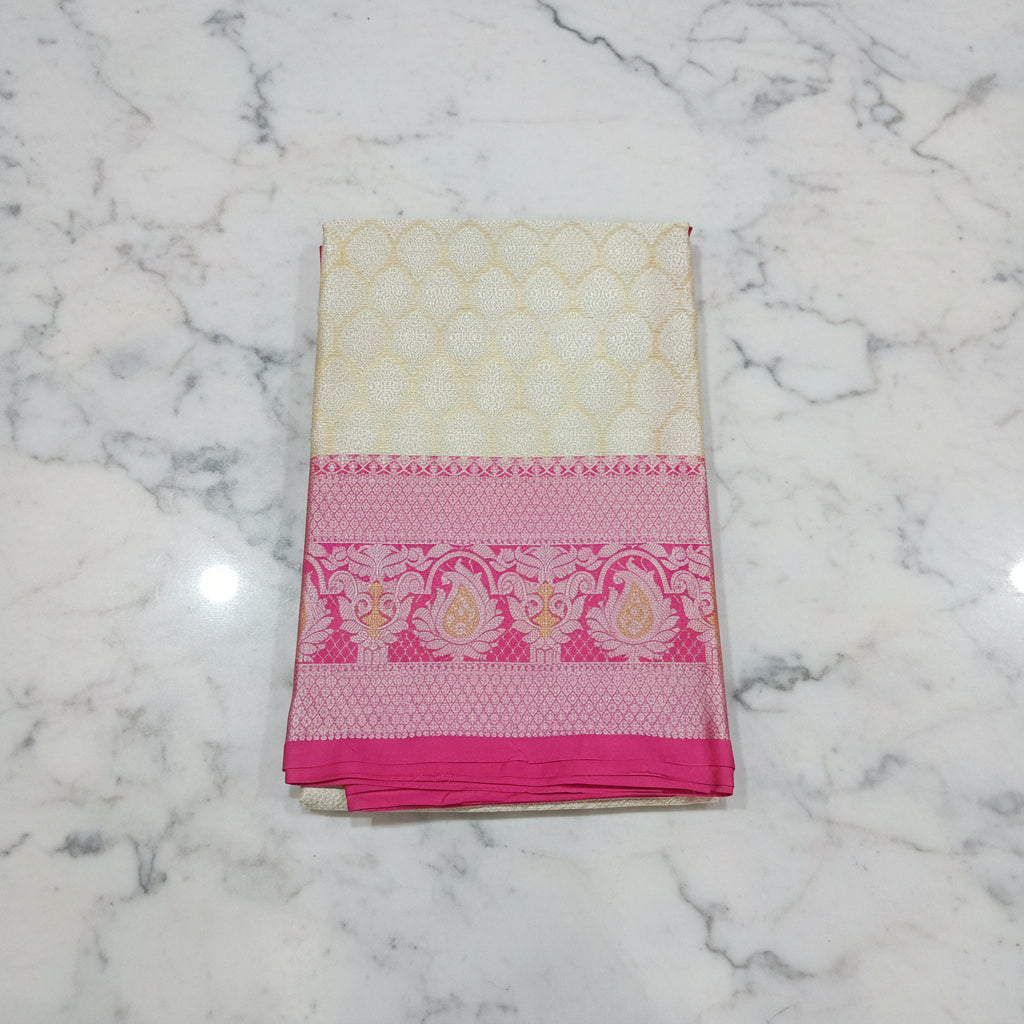 Semi Kanchipuram Silk Saree with Gold Zari Buttas and Contrast Border in Yellowish Cream Pink Color