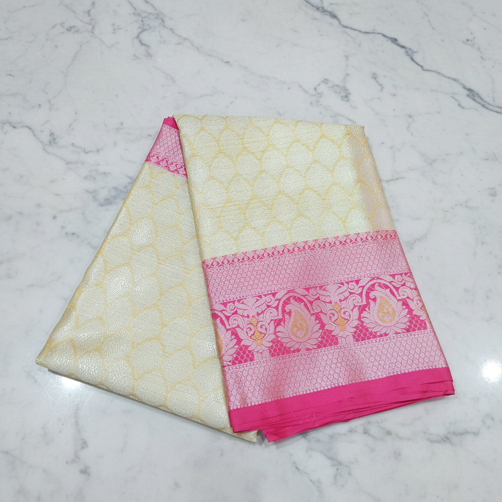 Semi Kanchipuram Silk Saree with Gold Zari Buttas and Contrast Border in Yellowish Cream Pink Color