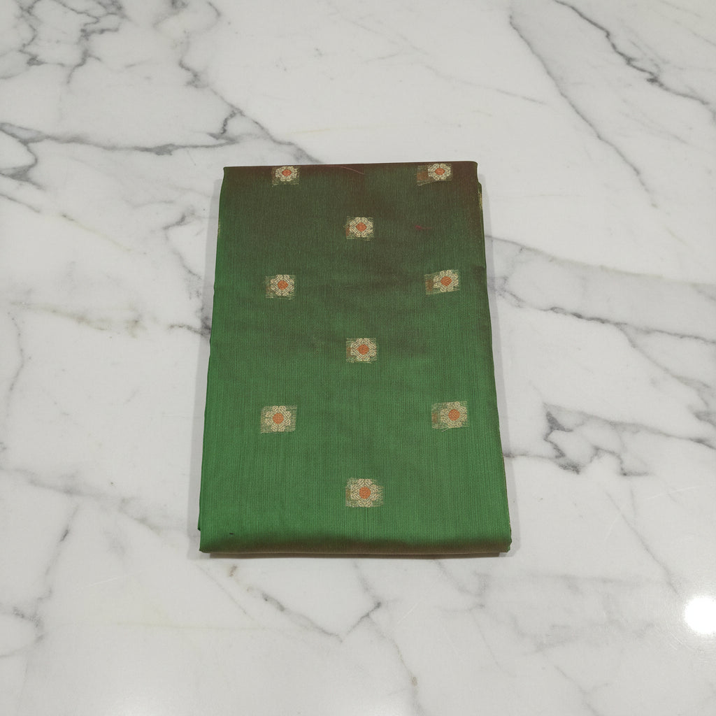 Chandheri Silk Saree with Flower Polka Dots Buttas with Gold Zari Border and Tassels in Leaf Green color