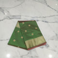 Chandheri Silk Saree with Flower Polka Dots Buttas with Gold Zari Border and Tassels in Leaf Green color