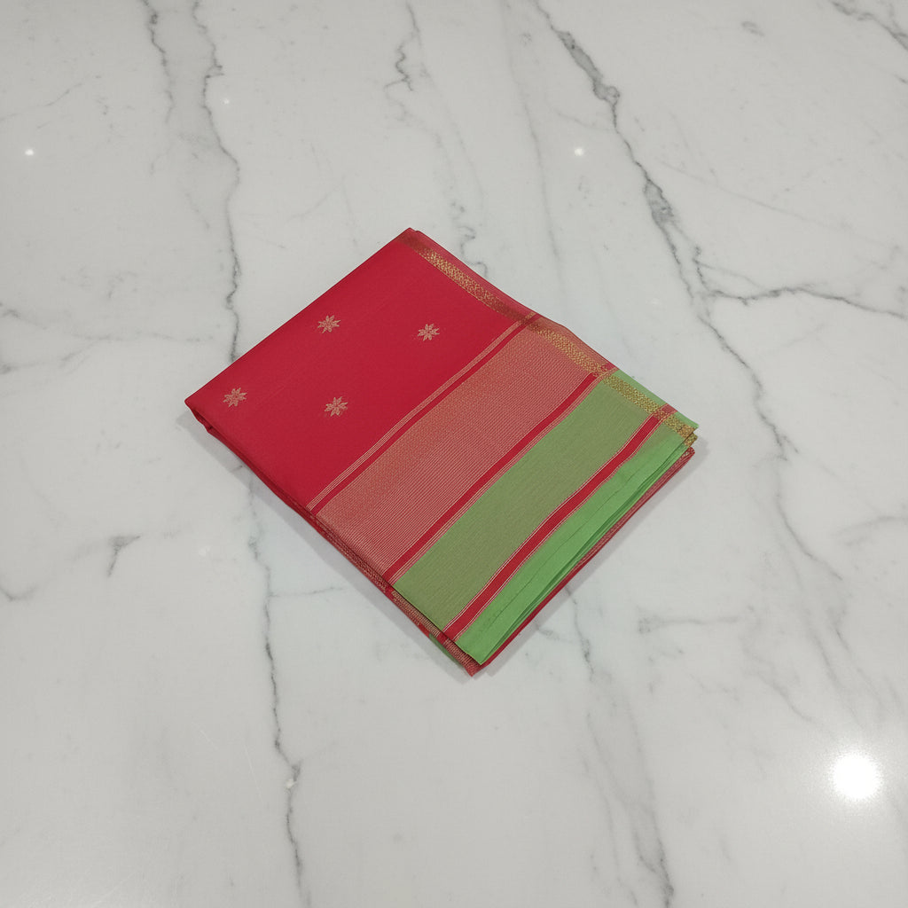 Chandheri Silk Saree with beautiful Butta Motifs in Fresh Leaf Green and Red Contrast with Tassels