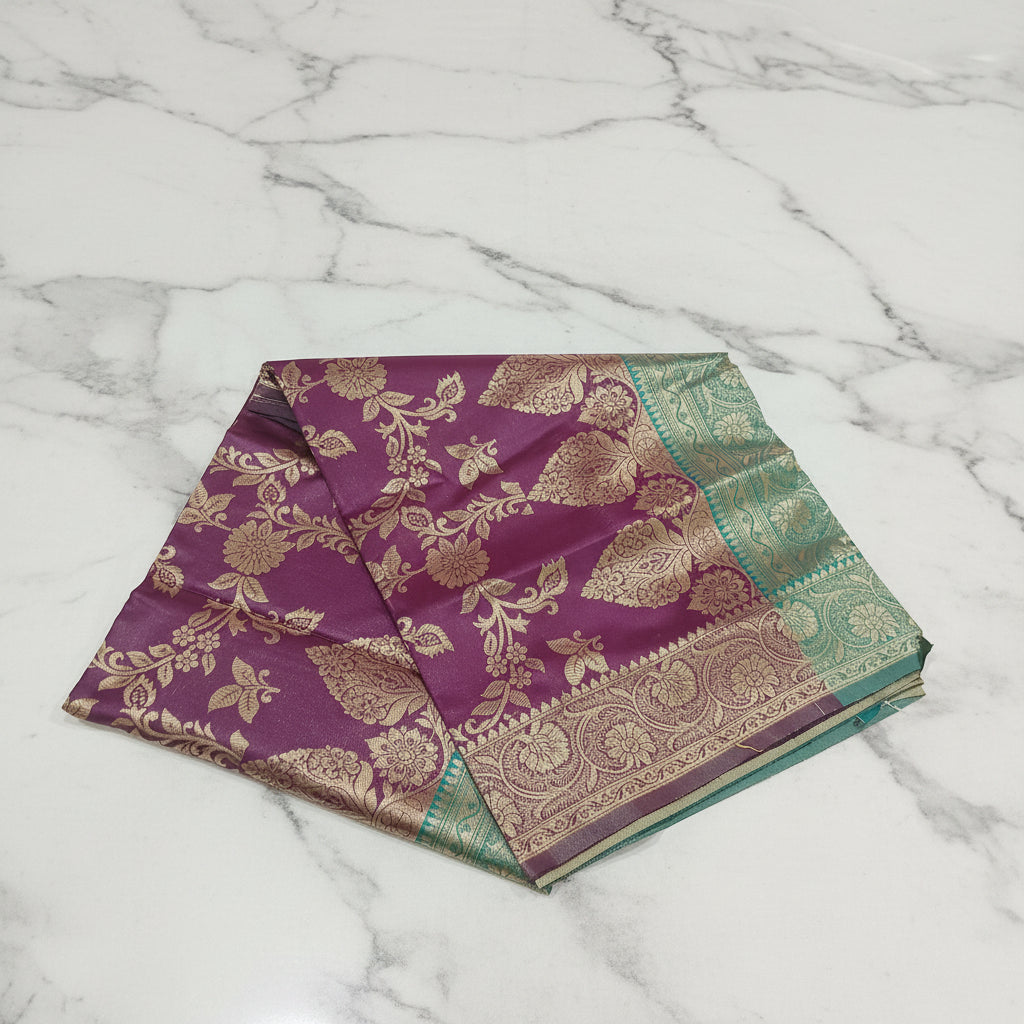 Banarasi Pure Silk Saree with luxurious Gold Zari Floral Buttas all over the saree and Pallu with leaf pattern in Purple Green Color