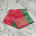 Banarasi Pure Silk Saree with luxurious Gold Zari Floral Buttas all over the saree and Pallu in Royal Pink and Green Color