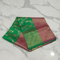 Banarasi Pure Silk Saree with luxurious Gold Zari Floral Buttas all over the saree and Pallu in Leaf Green and Maroon  Color