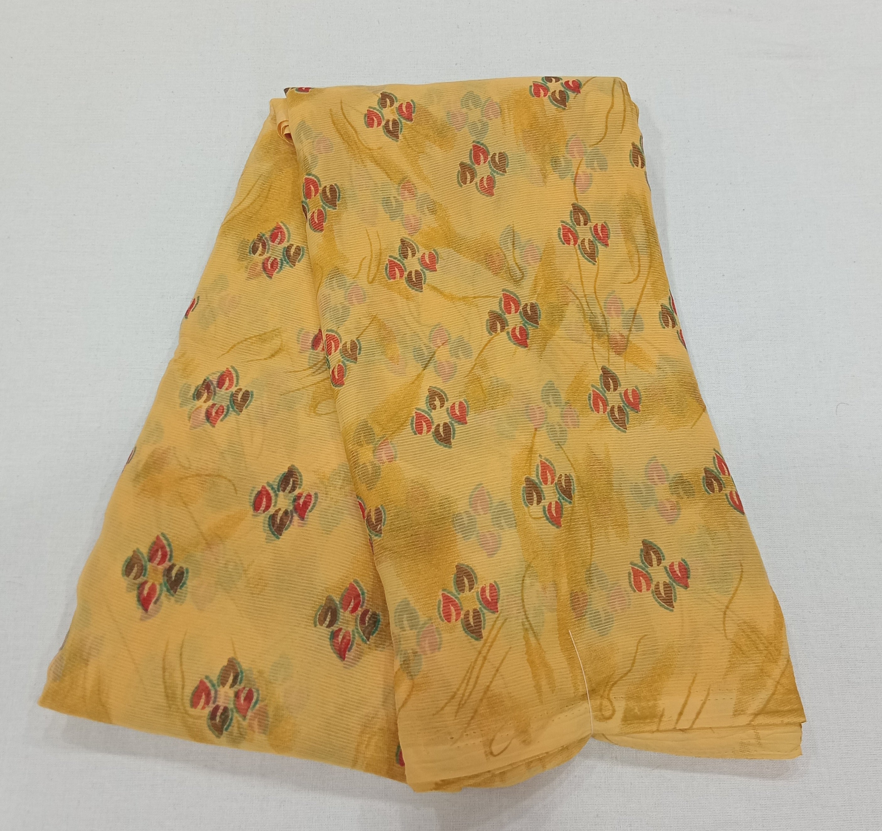 Chiffon Saree with printed Petals in Dark Yellow color