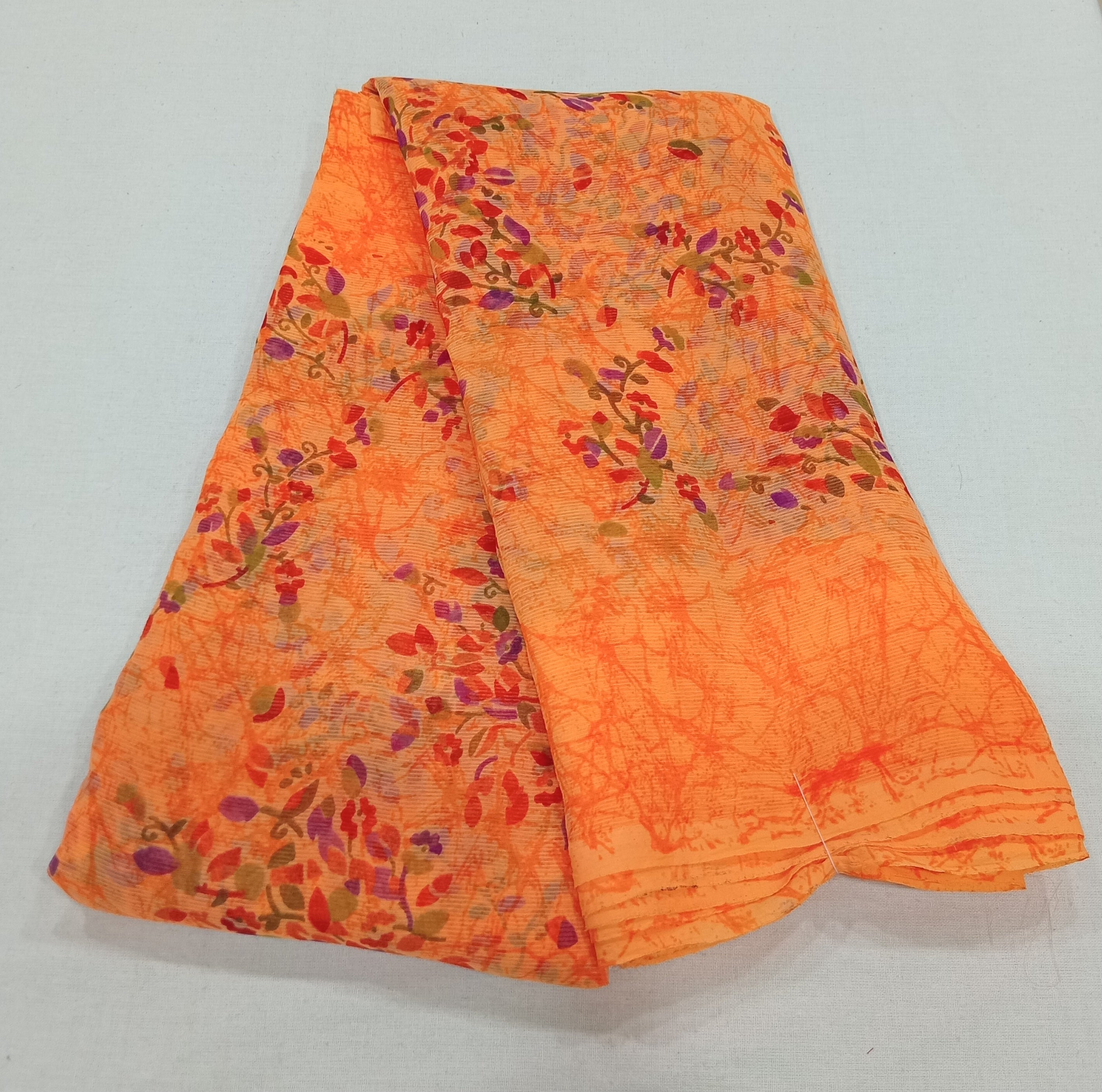 Chiffon Saree with printed Mini Flowers in Orange color