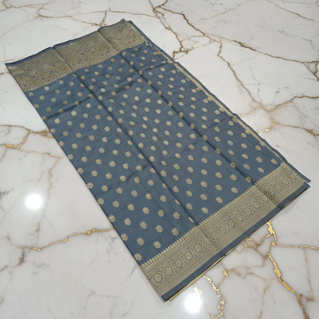 Gold zari buttas detail on grey Banarasi silk saree