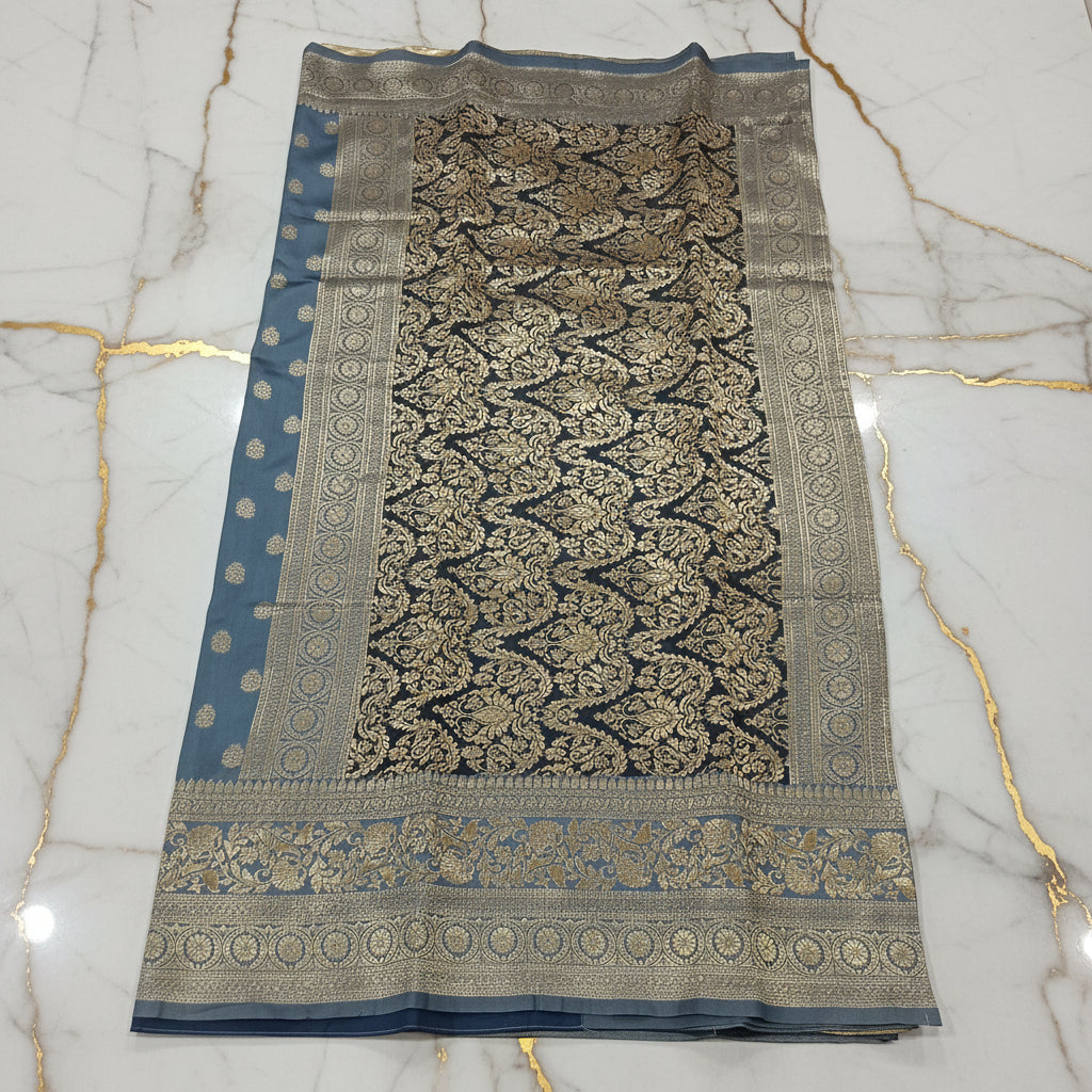 Close-up of zari weave texture on grey Banarasi silk saree