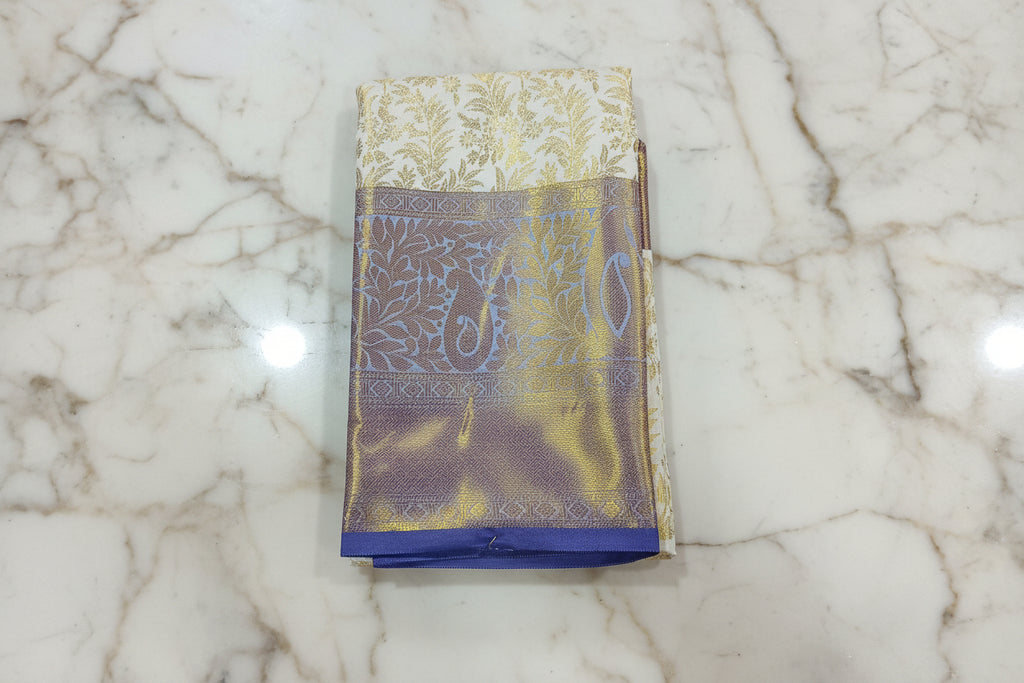 Kanchipuram Silk Saree with full gold zari weaving in Light Cream color in contrast Bluish Purple color border