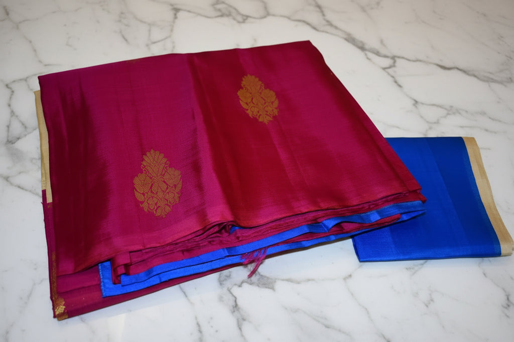 Kanchipuram Pure Silk Saree with bright gold Zari Motifs in Royal Pink color and Contrast Royal Blue Border