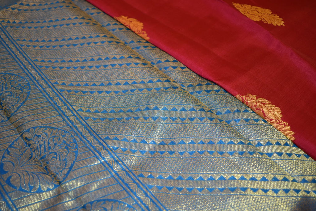 Kanchipuram Pure Silk Saree with bright gold Zari Motifs in Royal Pink color and Contrast Royal Blue Border