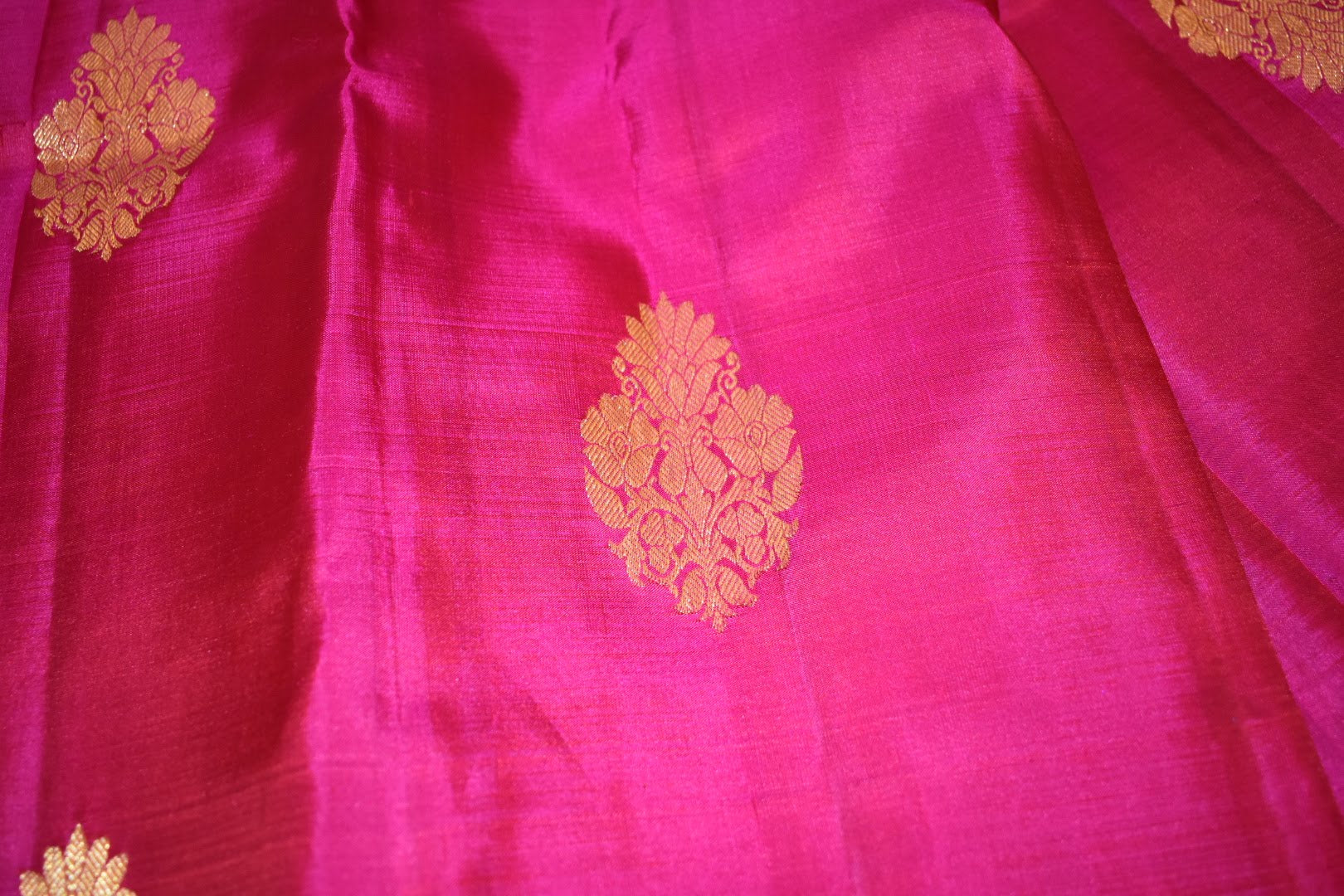 Kanchipuram Pure Silk Saree with bright gold Zari Motifs in Royal Pink color and Contrast Royal Blue Border