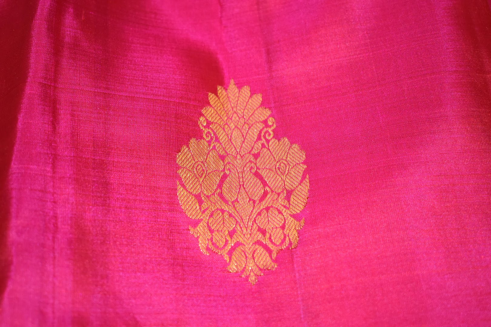Kanchipuram Pure Silk Saree with bright gold Zari Motifs in Royal Pink color and Contrast Royal Blue Border