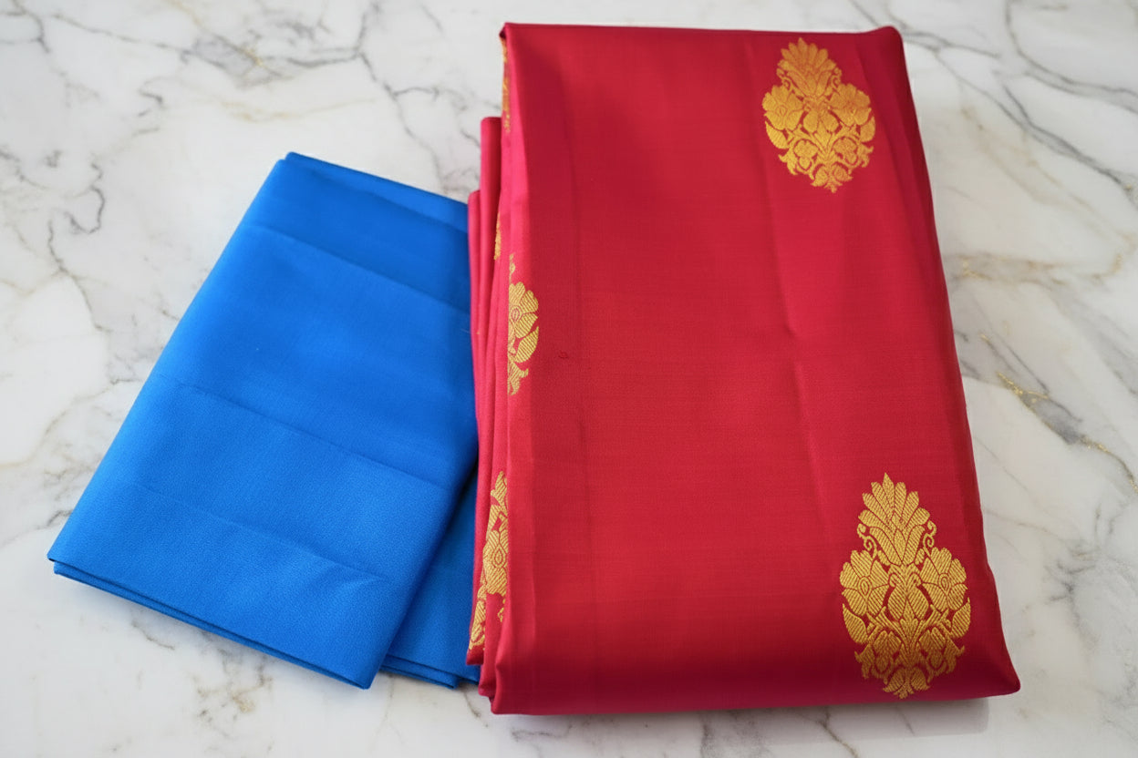 Kanchipuram Pure Silk Saree with bright gold Zari Motifs in Royal Pink color and Contrast Royal Blue Border