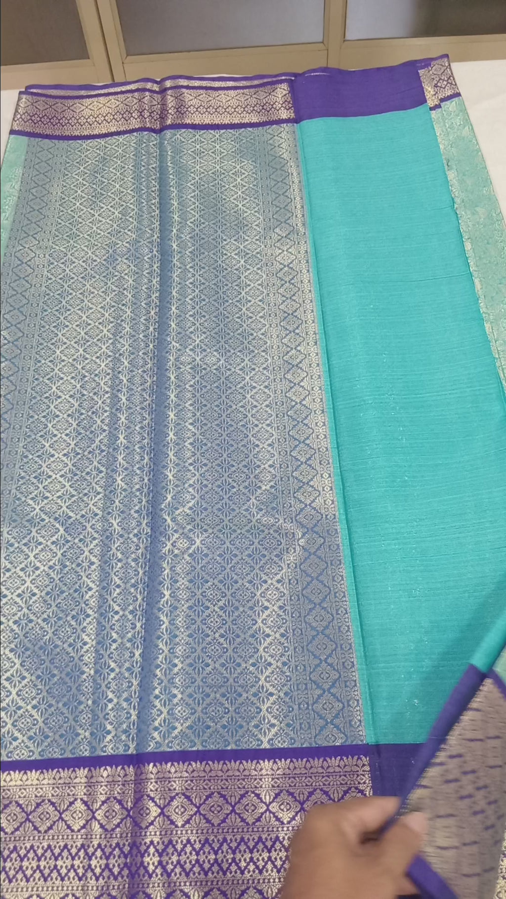 Kanchipuram Silk saree with Gold Zari pattern with Gold Butta all over saree and pallu in Bluish Blue Color