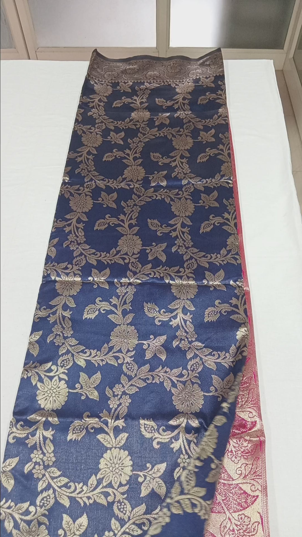 Banarasi Pure Silk Saree with luxurious Gold Zari Floral Buttas all over the saree and Pallu with leaf pattern in Navy Blue Red Color