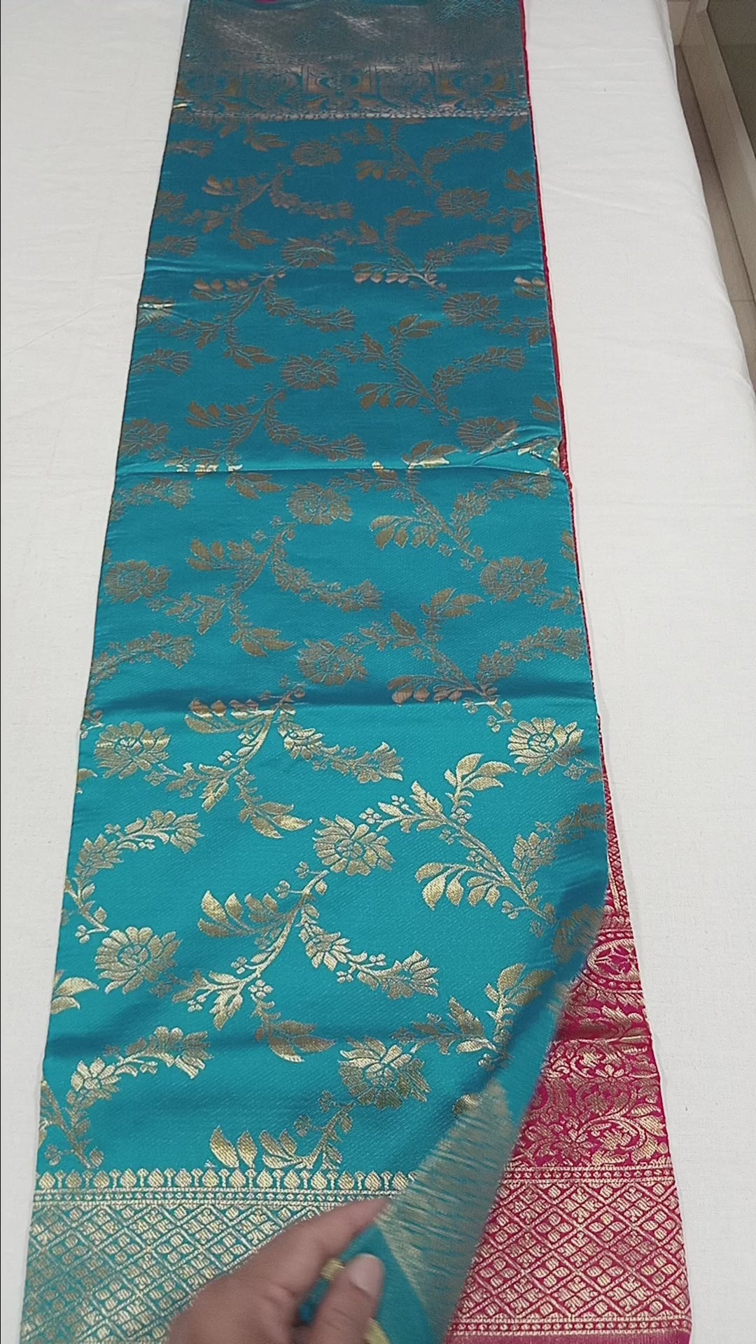 Banarasi Pure Silk Saree with luxurious Gold Zari Floral Buttas all over the saree and Pallu in Turquoise Blue and Red Color