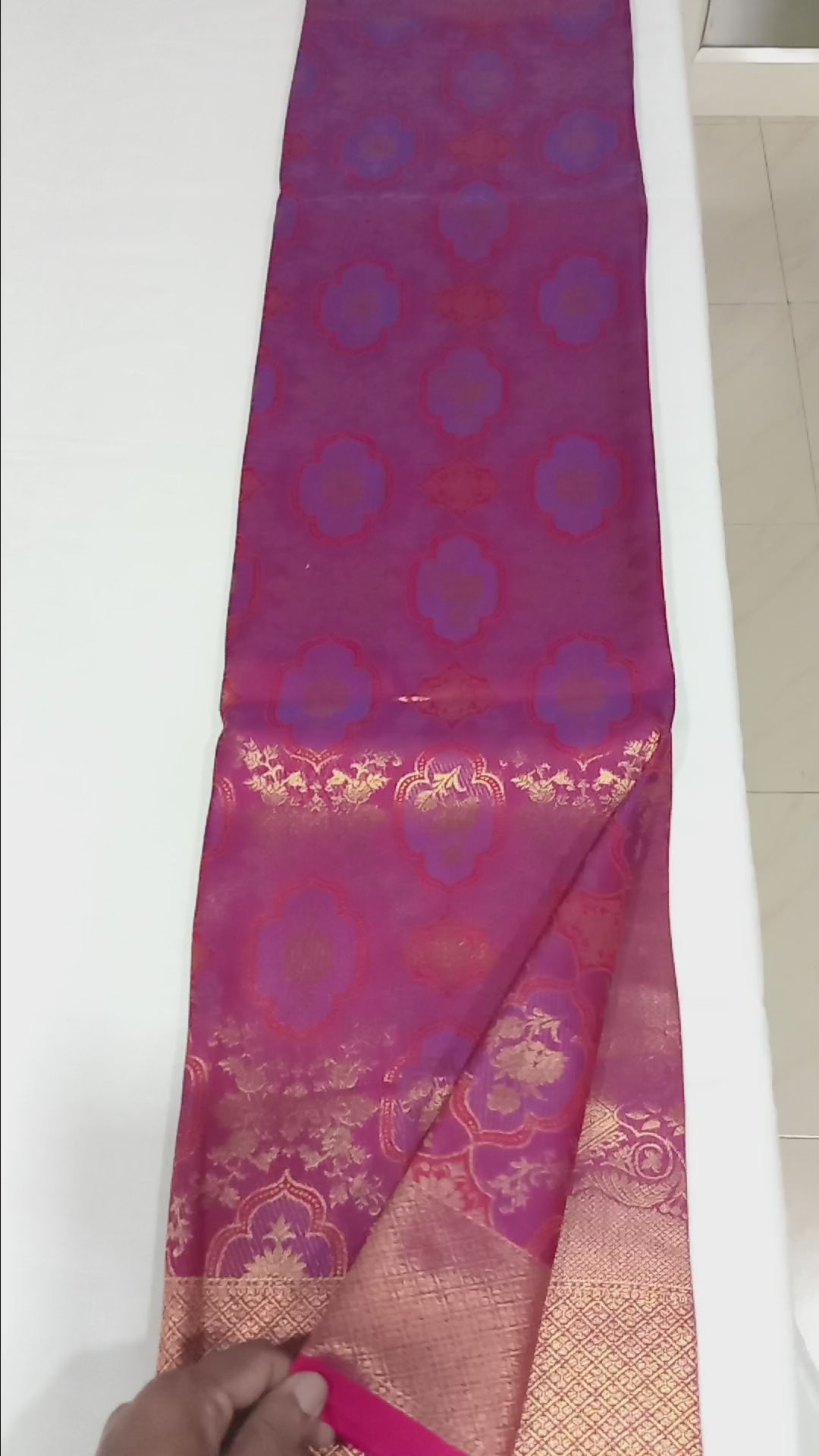 Kanchipuram Pure Silk Saree with detailed Butta motifs and luxurious Pallu in Reddish Pink color