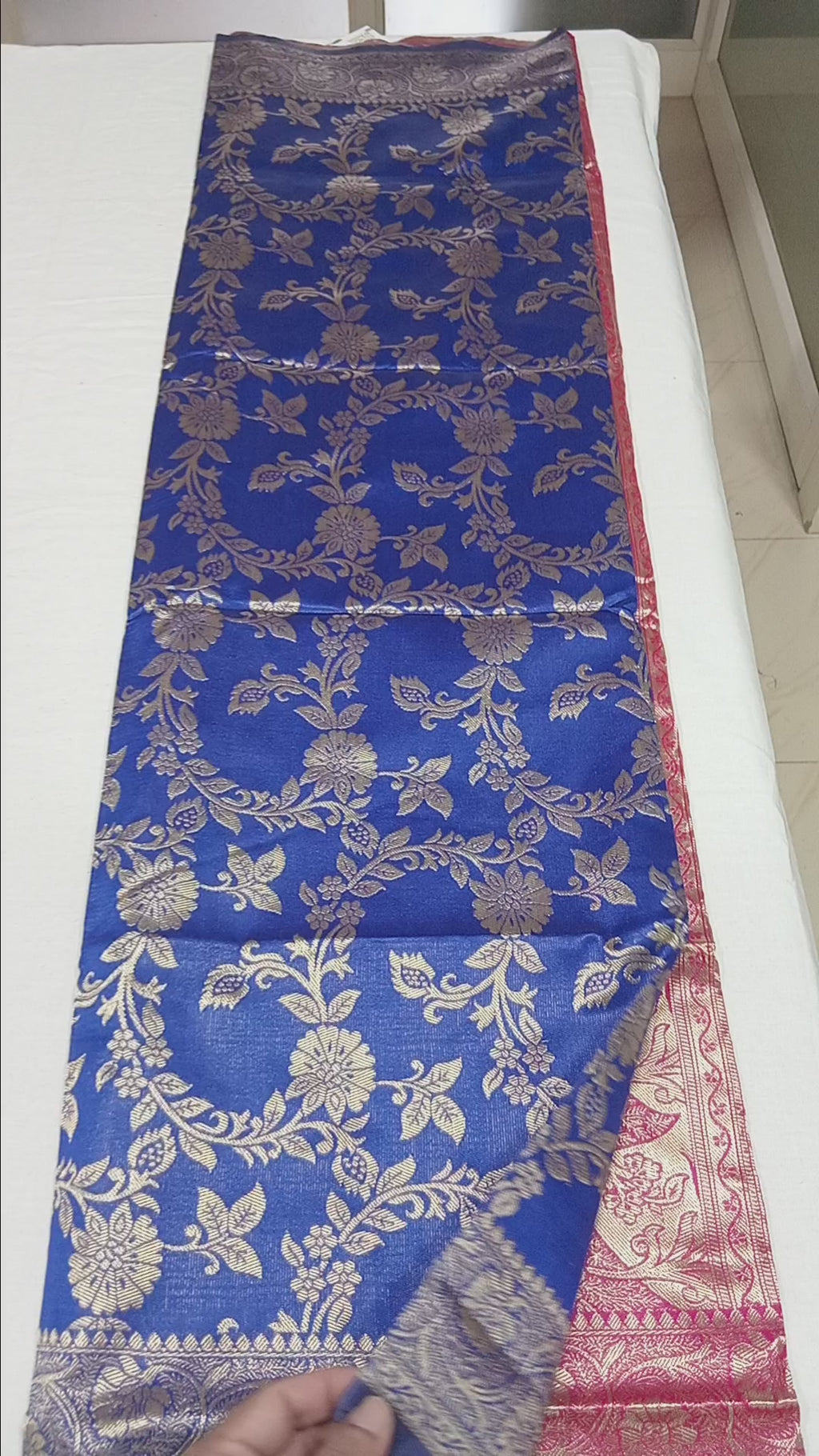 Banarasi Pure Silk Saree with luxurious Gold Zari Floral Buttas all over the saree and Pallu with leaf pattern in Royal Blue Red Color