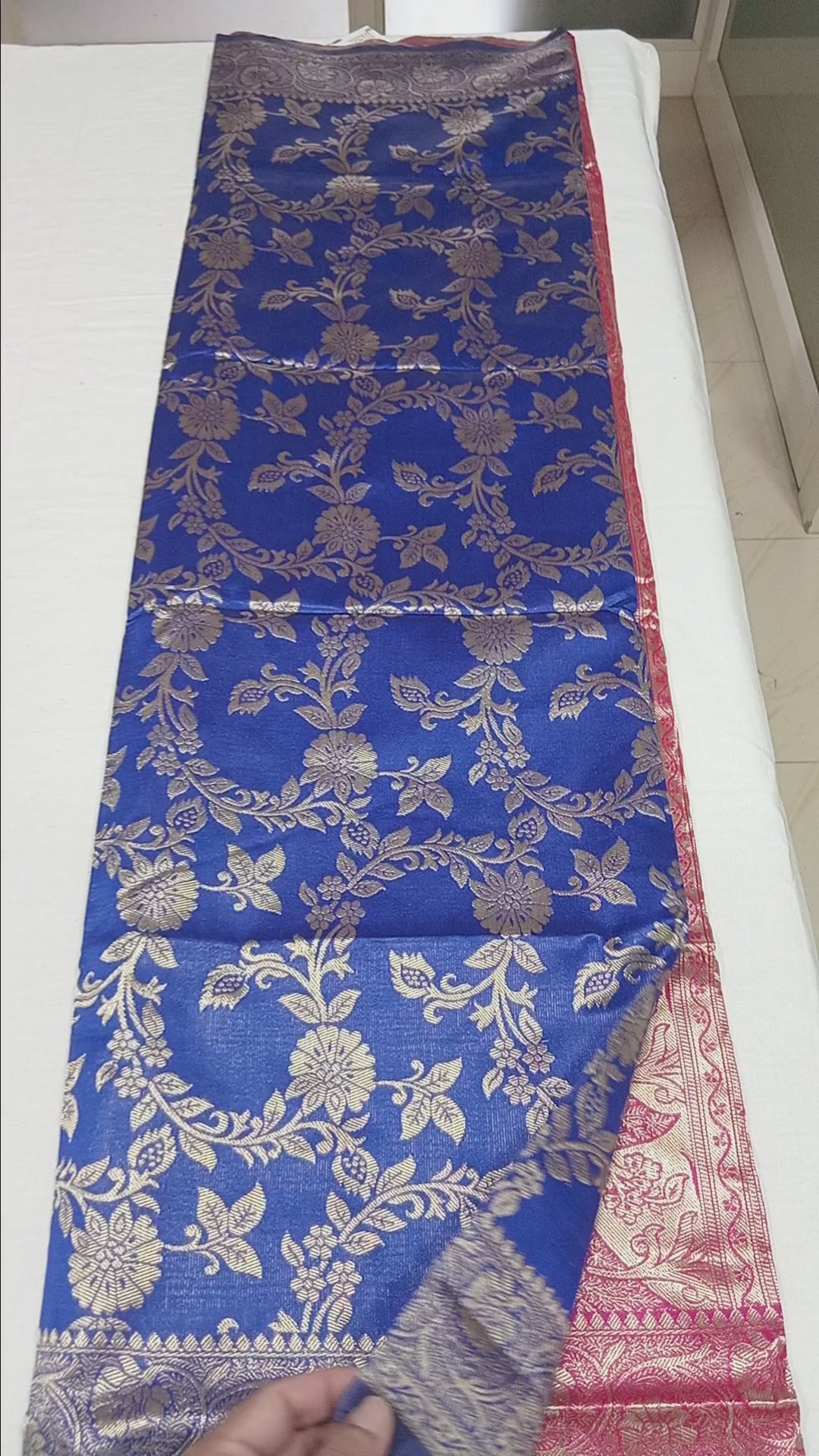 Banarasi Pure Silk Saree with luxurious Gold Zari Floral Buttas all over the saree and Pallu with leaf pattern in Royal Blue Red Color